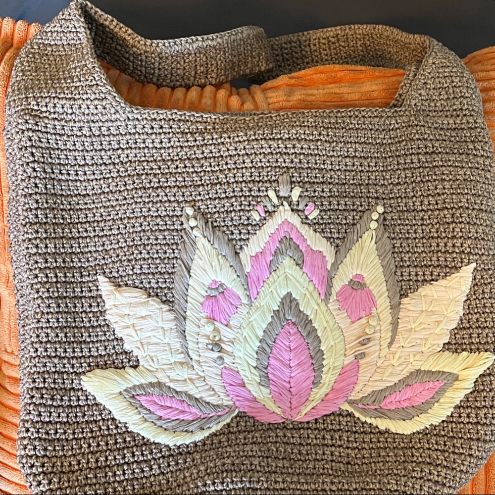 The Sak Brown Crochet Bag with Pink and Cream Lotus design. Limited edition!